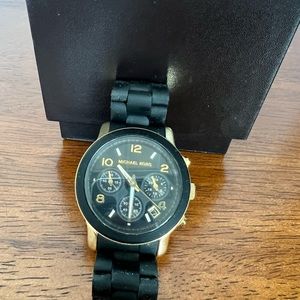 Michael Kors black and gold women’s watch